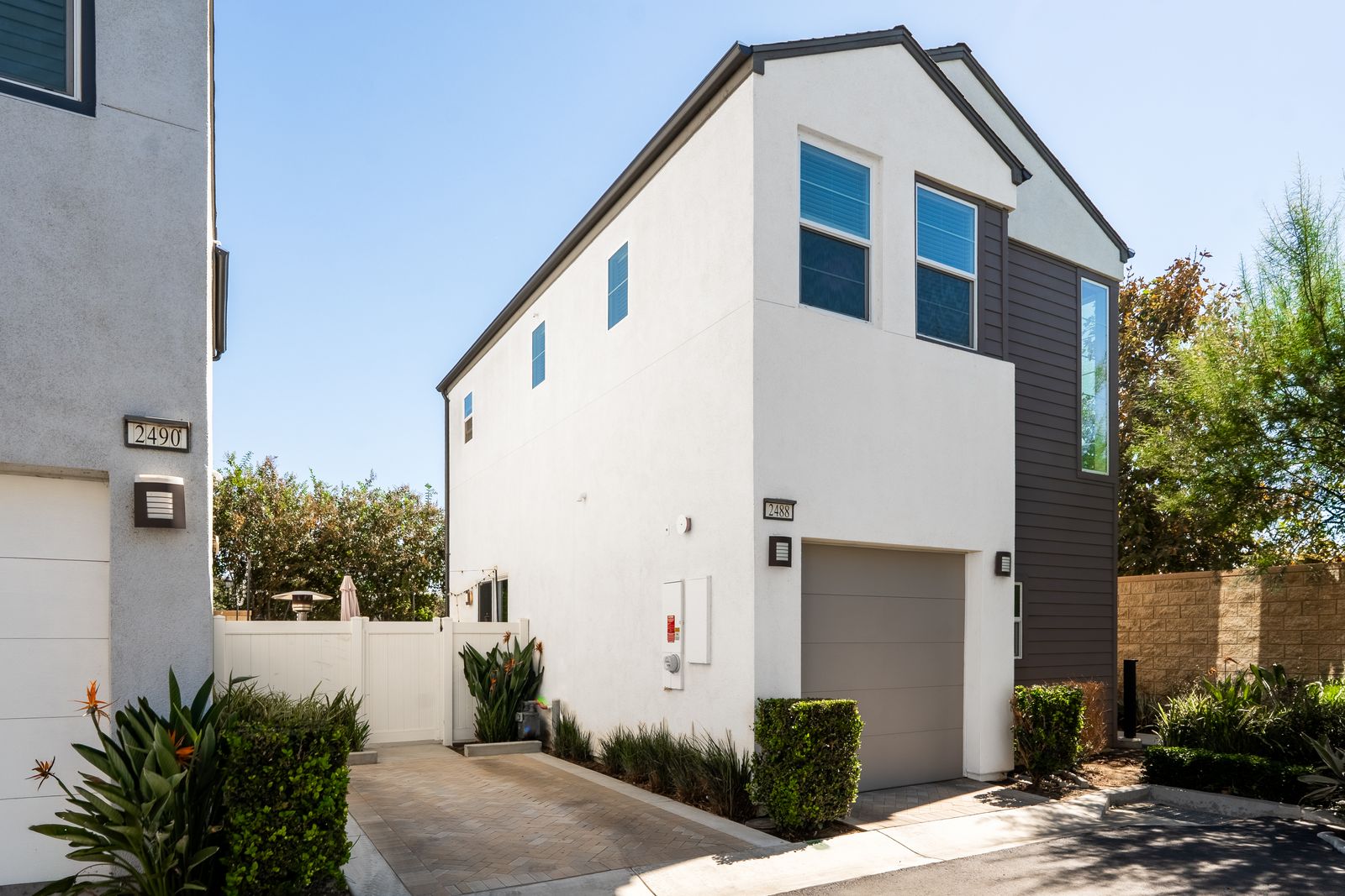 Modern two-story home with a garage and side walkway